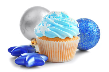Blue cupcake and Christmas decor isolated on white