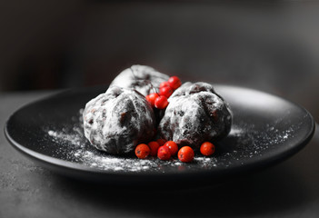 Chocolate balls with ash berry on table