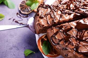 Sliced chocolate pie with mint, closeup