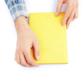Man hands holding book, isolated on white