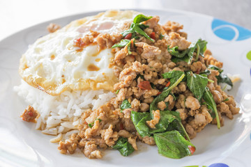 Thai spicy food, Spicy fried pork with basil and fried egg