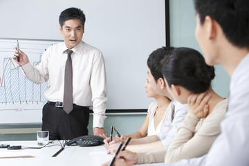 Business Executive Presenting to Business Team