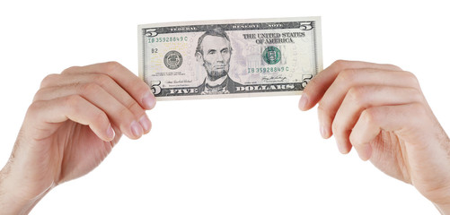 Hands holding five dollar banknote, isolated on white