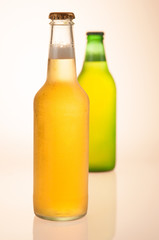 Yellow and Green Beer Bottles With Depth of Field