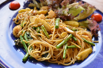 spaghetti with sea food on blue plate