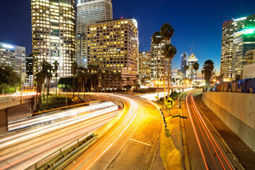 Fototapeta na wymiar traffic on urban road and building at night
