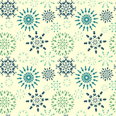 Christmas seamless pattern. Blue and green snowflakes on light yellow background. Winter theme retro texture. Vector illustration.