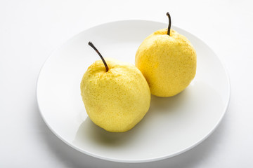 Asian pears on white plate