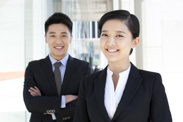 Portrait of happy coworkers in downtown district