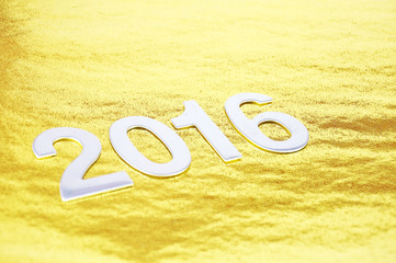 selective focus or 2016 number over golden background
