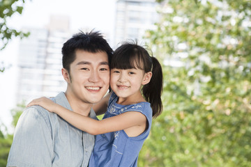 Fototapeta premium Portrait of happy young father and daughter
