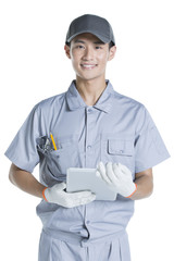 Repairman holding a digital tablet