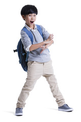Cool boy with schoolbag on back
