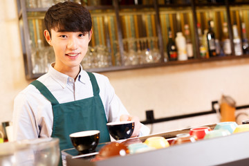 portrait waitress and waiter in cafe