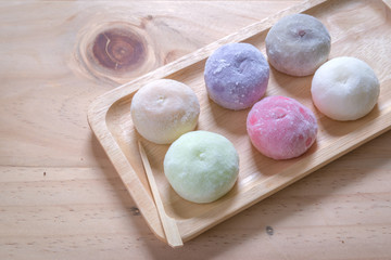 The colorful mochi dessert ice cream on wood plate ,Close Up photo with selective focus.
