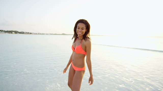 Portrait of African American girl on ocean beach 