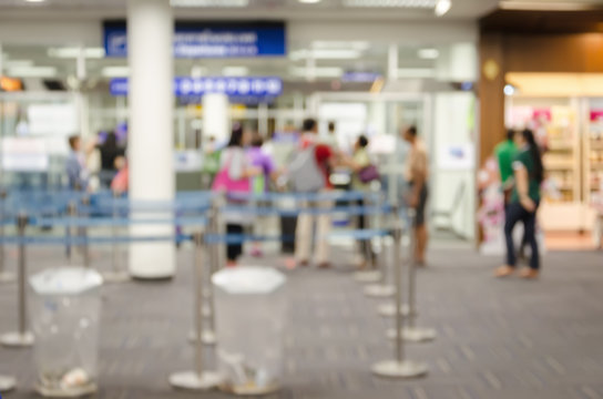 Abstract people walking at International Airport blurred background with bokeh in Terminal Departure Check-in.