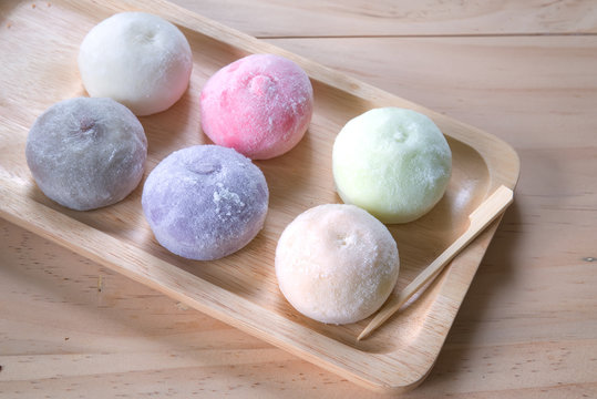 The colorful mochi dessert ice cream on wood plate ,Close Up photo with selective focus.