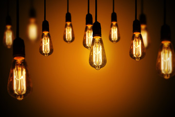light bulbs on a warm gradient background
