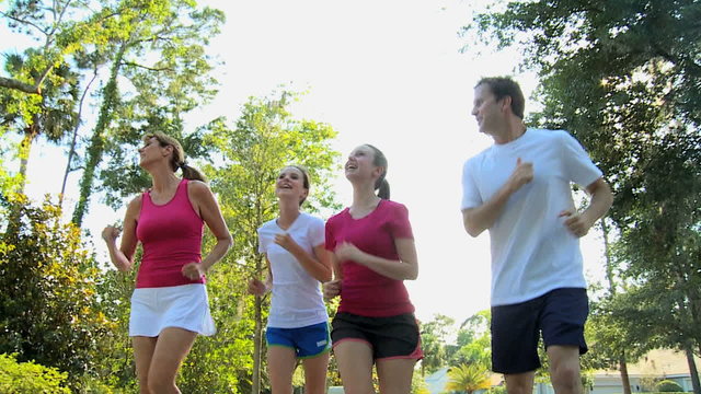 sport recreation jogging lifestyle Caucasian family together outdoors fitness