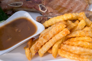 French Fries and Steak Pork Chop with mushroom mustard sauce.