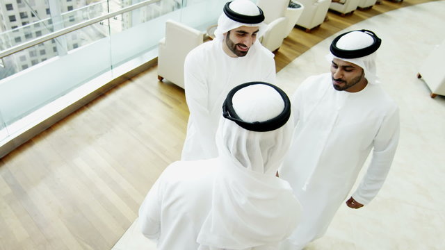 male Emirati kandura hotel leisure international travel lifestyle handshake