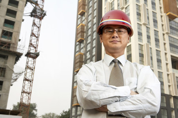 Construction Contractor Standing On Building Site