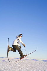 Young man playing around with ski equipment