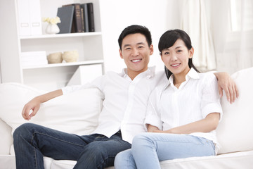 Young couple sitting in sofa