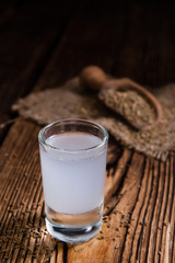 Ouzo on wooden background