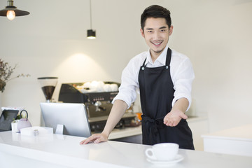 Coffee shop owner working