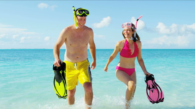 healthy outdoor snorkeling lifestyle Caucasian couple achievement beach resort
