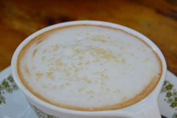 sugar dressing on milk foam in cappuccino coffee