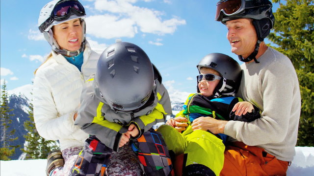 Caucasian family snow skiing children boys healthy outdoor vacation lifestyle