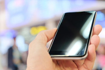 Close up of using smart phone at the airport.