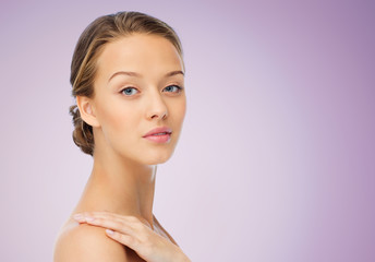 smiling young woman face and shoulders