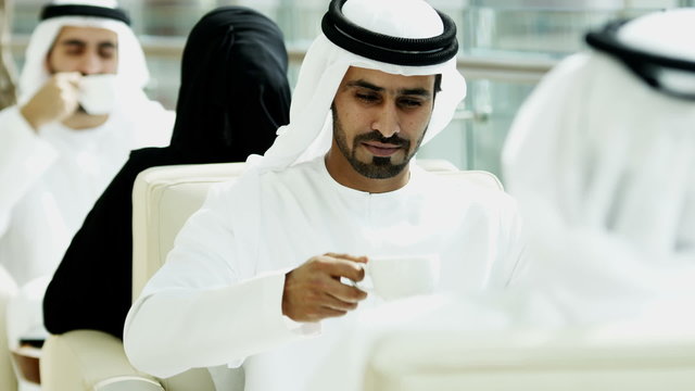 Arab males kandura tablet technology social leisure lifestyle hotel traveller