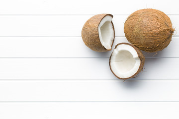 halved and whole coconut