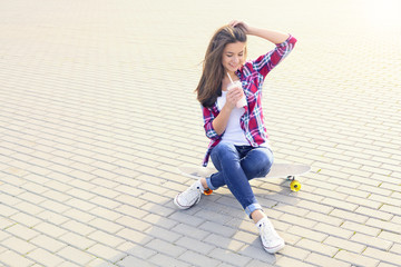 Skateboarder girl with milkshake