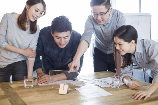 IT workers developing digital tablet