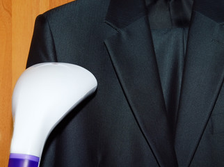 steam cleaning a suit in laundry