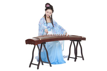 Young woman in Chinese traditional costume plucking Chinese zither