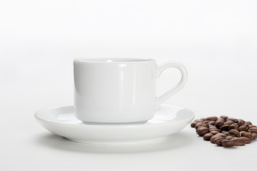Coffee cup and beans on a white background.