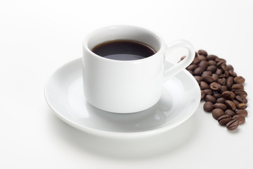 Coffee cup and beans on a white background.