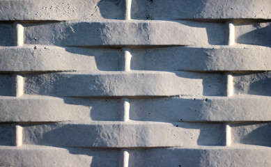 Abstract weathered texture stained old flaking stucco light gray background