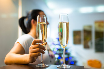 Woman on the date with flutes of champagne