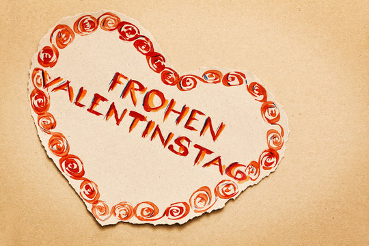 Postcard with note "Frohen Valentinstag" written on grunge heart