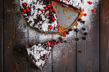 Homemade berry cake on the wood background