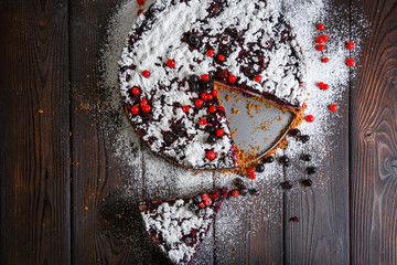 Homemade berry cake on the wood background
