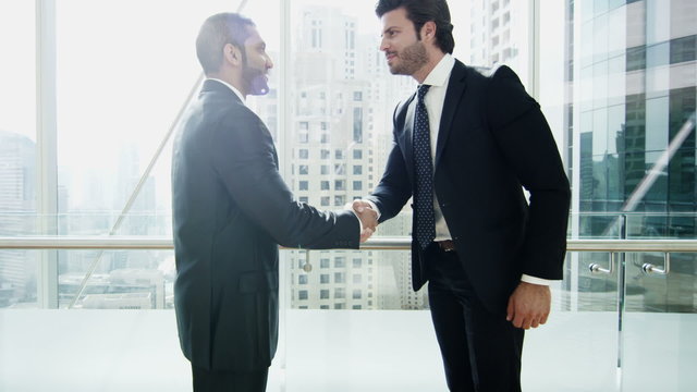 handshake Middle Eastern American business male real estate property development